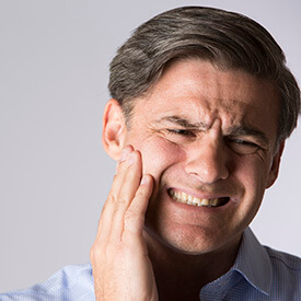 Man experiencing tooth pain